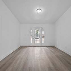 apartment unit with wood floor at at Oaks At Magnolia Apartments located in Tallahassee, FL